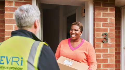 3802fb05-d56e-46ac-aabc-3a0e159ee384_Courier-and-customer-at-doorstep-suburban