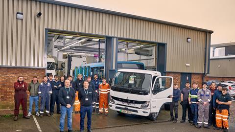 Students at Cardiff and Vale College, with Lecturers Ben Young and Lee Whittaker (front left and right) and their FUSO eCanter electric truck