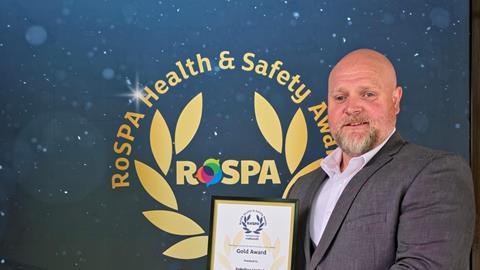 Main Ken Bell HSEQ Manager Palletline proudly displays the company's 12th RoSPA Gold Award