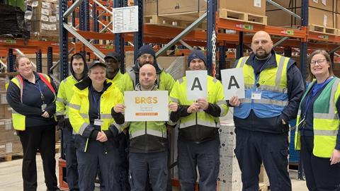 LTS Global Solutions employees proudly display the company's newly gained BRCGS AA certificate