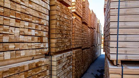 Pallets with wooden bars, a large warehouse of boards.