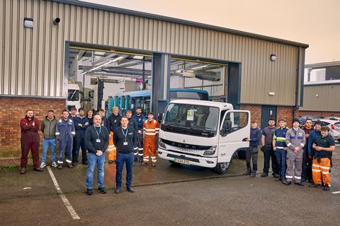 Students at Cardiff and Vale College, with Lecturers Ben Young and Lee Whittaker (front left and right) and their FUSO eCanter electric truck