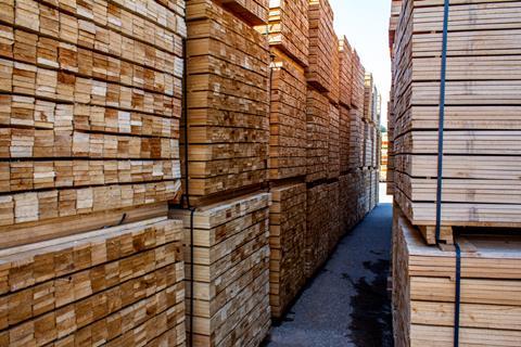 Pallets with wooden bars, a large warehouse of boards.