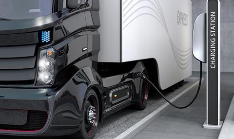 Hybrid electric truck being charging at charging station