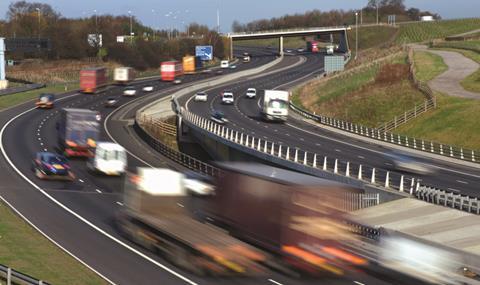 Lorries travelling on the A1/M motorway near Leeds Yorkshire UK