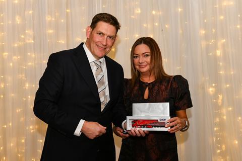Sally Blamire reaches the 25 year milestone. Pictured with MD Phil Jones.