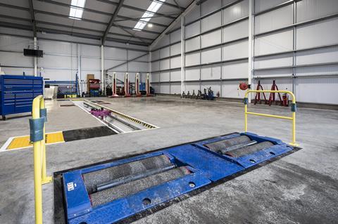 The site includes a dedicated inspection pit lane for truck inspections and repairs.