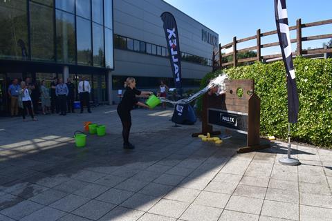 Sian Jones gives Pall-Ex Group CEO, Kevin Buchanan, a soaking at the company's BBQ Extravaganza event - FILE01[31889]